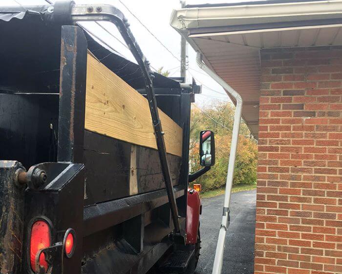 Property expenses when a dump truck hit the property and gutter